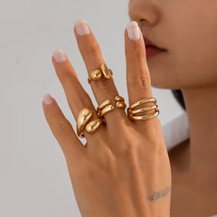4-Piece Polished Liquid Metal Textured Ring Set