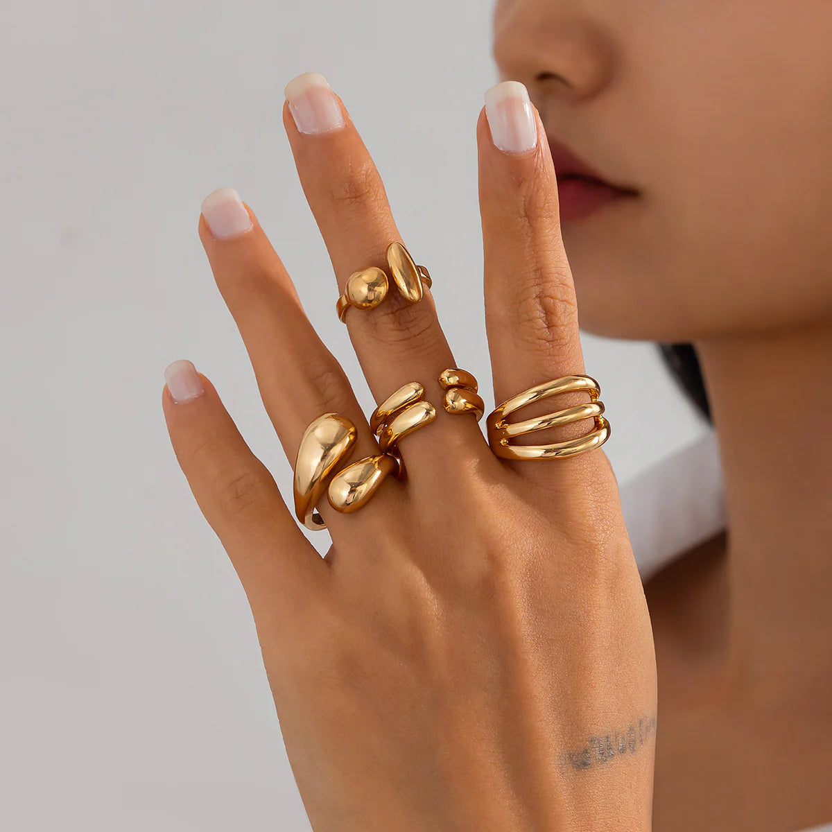 4-Piece Polished Liquid Metal Textured Ring Set